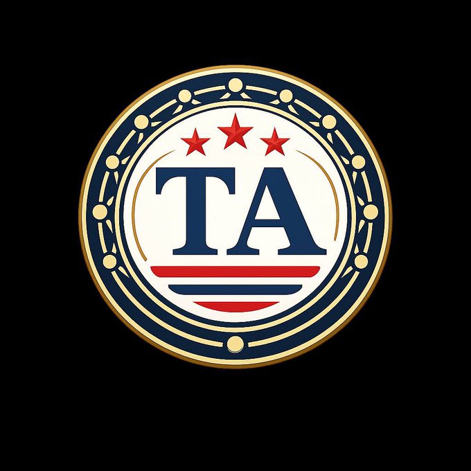 A circular badge logo on a black background featuring the letters 'TA' in navy blue, three red stars, and red stripes resembling an American flag motif, encircled by a gold and navy blue border.