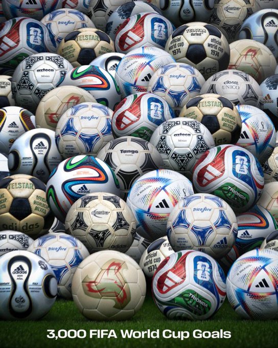 A pile of stacked footballs rests on grass, featuring references to iconic tournaments like the 1974 World Cup and Telstar, with the caption "3,000 FIFA World Cup Goals" celebrating the unplanned, unifying magic of football—mirroring the post's message about the sport's power to bring fans together through unforgettable, spontaneous moments.