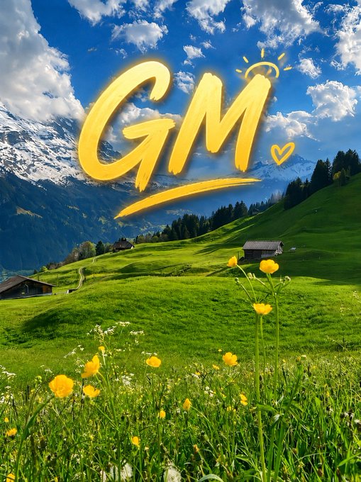A vibrant landscape photograph of green alpine meadows with yellow wildflowers, small wooden cabins, and snow-capped mountains under a blue cloudy sky, overlaid with large yellow handwritten-style text reading 'GM' with a small heart and sunshine doodle.