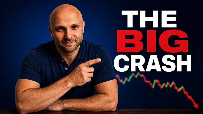 A bald man in a navy blue polo shirt points to the right at bold text reading "THE BIG CRASH," with a downward-trending red and green stock chart below, suggesting a financial market decline tied to the breaking XRP news about banks.
