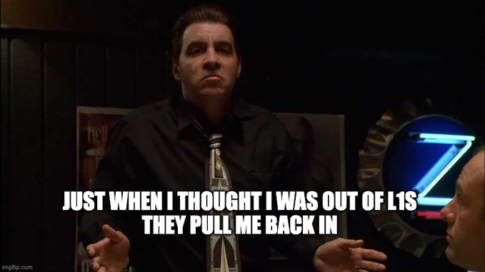 A man in a black shirt and tie gestures with his hands in a dimly lit room, with the caption "JUST WHEN I THOUGHT I WAS OUT OF L1S THEY PULL ME BACK IN," humorously echoing the "Godfather" quote to express the post's sentiment that BNB Chain is launching yet another Layer-1 blockchain despite the crowded L1 market.