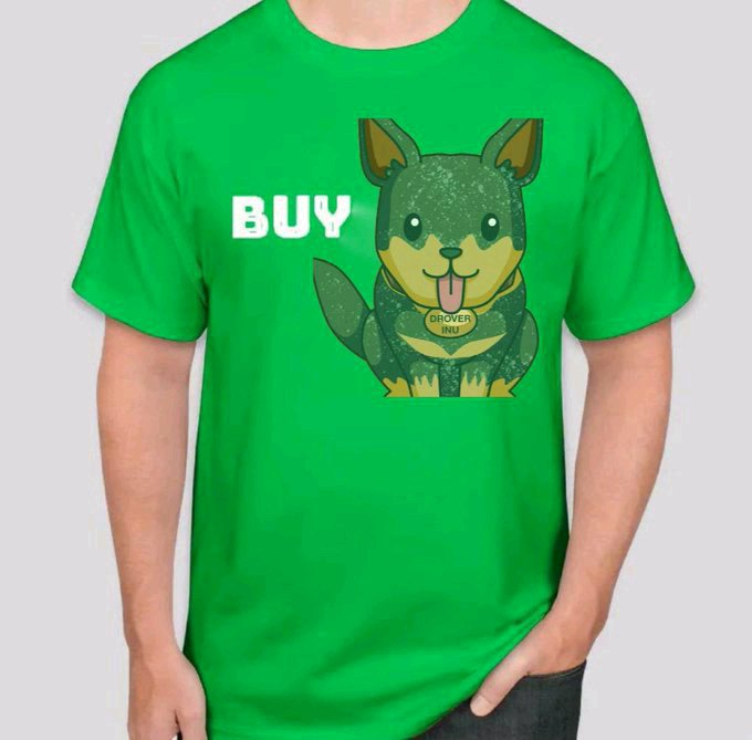A green t-shirt product photo featuring a cartoon Shiba Inu dog character wearing a collar that says 'DROVER INU' alongside the word 'BUY' in white pixelated text.