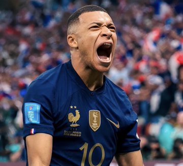 Kylian Mbappé, wearing France's #10 jersey, screams in celebration in a packed stadium—a fitting visual for the massive $1.2 million bet on France to win their match against Morocco, which would pay out over $2 million on Polymarket.