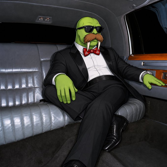 A green walrus character wearing sunglasses, a tuxedo, and a red bow tie, sitting in the back of a luxurious limousine.