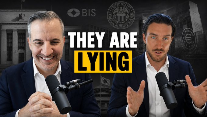 Two men sit across from each other at microphones for a podcast, smiling and gesturing, with bold text reading "THEY ARE LYING" between them against a backdrop featuring BIS and Federal Reserve logos. The image serves as a thumbnail for an interview-style discussion about XRP and emerging financial systems, matching the post's topic about price movements and the transition to a new financial system.