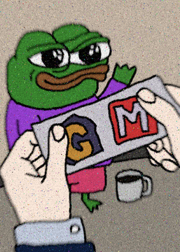 A cartoon of Pepe the Frog sitting at a table while two hands hold up a 'GM' (Good Morning) toy in front of him, with a coffee mug nearby.