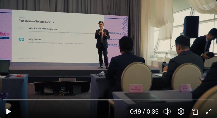 A video screenshot (0:19 / 0:35) of a man on stage titled 'The Korea-Solana Nexus,' discussing Korean manufacturing and Solana to an audience.