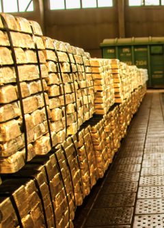 Stacks of gleaming gold bars line a secure vault, while a green container marked "101" sits in the background—evoking the image of a global monetary reset where physical gold and digital assets like XRP converge to redefine the financial system.