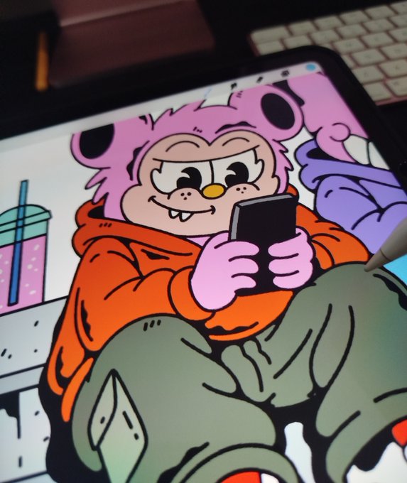 A tablet screen displays a digital illustration of a pink bear-like character in an orange hoodie holding a smartphone, with a stylus visible on the right.