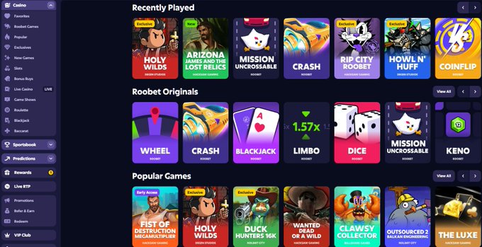 A screenshot of the Roobet casino website interface showing categories like Recently Played, Roobet Originals, and Popular Games, featuring titles such as Holy Wilds, Mission Uncrossable, Crash, and Wheel.