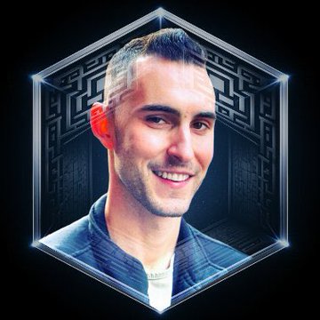 The image features a man with short hair wearing a blue jacket, smiling at the camera. The background of the photo has a black and white patterned design that appears to be a maze or an abstract art piece. There are also some text elements in the image, including "@Jakegallen" and "@Pump". This suggests that the man might have been watching a video on social media where he was discussing the interesting space-related content shown in the photo.