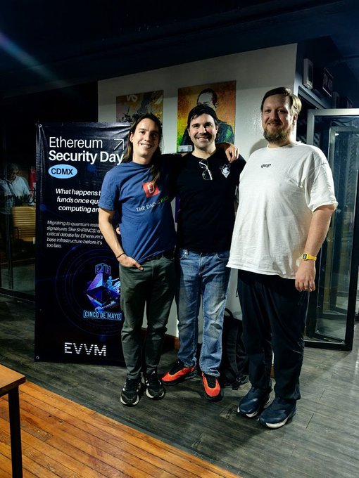 Three people pose for a photo next to a banner reading 'Ethereum Security Day CDMX' featuring the 'Cinco de Mayo' and 'EVVM' logos.