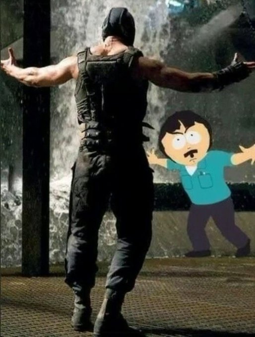A scene from a movie showing a muscular figure in tactical gear standing before a waterfall with arms outstretched, accompanied by a digitally added cartoon character (Randy Marsh from South Park) with a confused expression.