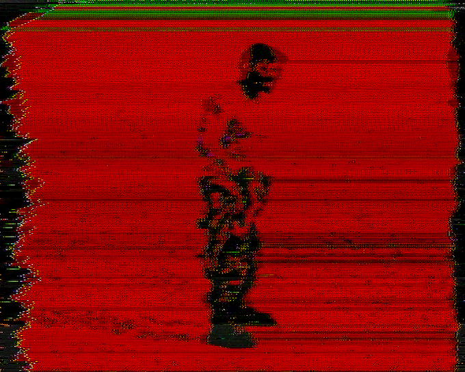 The image features a man standing against a red background with his hands at his sides. The caption of the image reads "¡Good morning! I have a_day ahead of various updates on my very outdated computer so I can't mint on @objktcom Today, which means tomorrow will be the day for this new work".