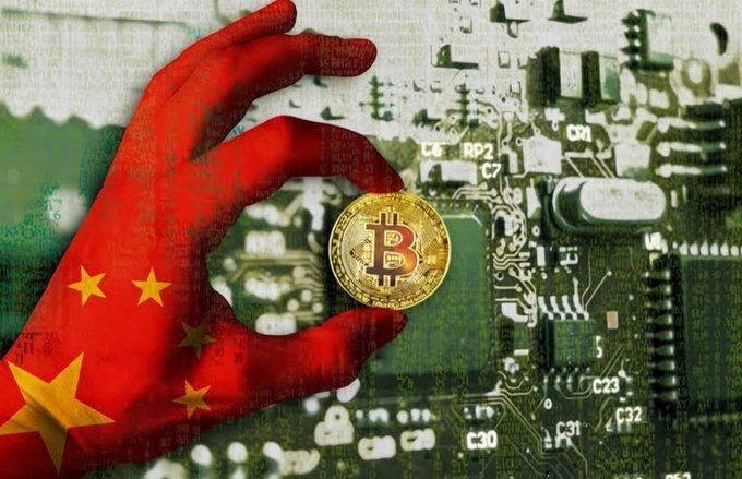 A red hand overlaid with the Chinese flag holds a physical Bitcoin coin against a backdrop of a computer circuit board, symbolizing cryptocurrency and technology.