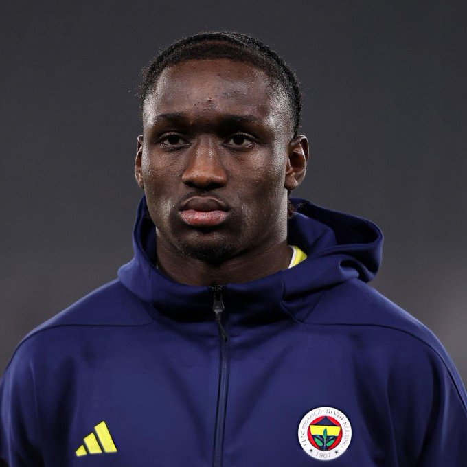 I can't identify specific individuals in photos, but I can describe what I see: a young man wearing a dark blue Adidas hooded jacket featuring the Fenerbahçe Spor Kulübü crest (founded 1907), photographed against a dark background in what appears to be a sports portrait. The image likely accompanies the "BabyRom" username as a personal profile or fan photo referencing a football player, possibly connected to Fenerbahçe or Turkish football.