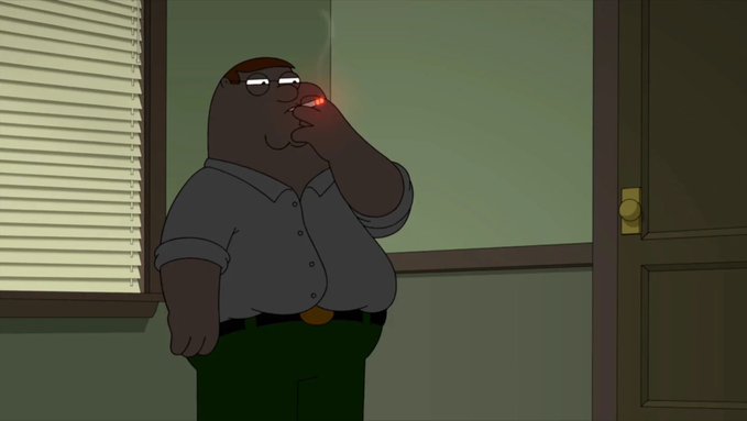 A heavyset man stands indoors smoking a cigarette, the glowing ember illuminating his face as smoke drifts upward, matching the post's "(Inaudible sound) (Darkness intensifies)" caption that suggests a quiet, tense moment of escalating unease.