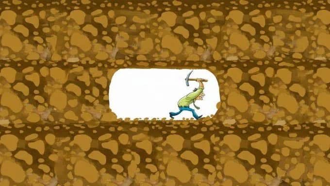 An animated cartoon scene showing a character in a yellow shirt and blue pants digging with a pickaxe in a tunnel surrounded by brown, rocky earth.