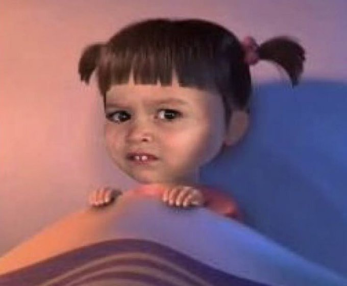 Vintage-style portrait photo of a young girl with pigtails resting her hands on a rounded surface, with a soft blue and purple background.