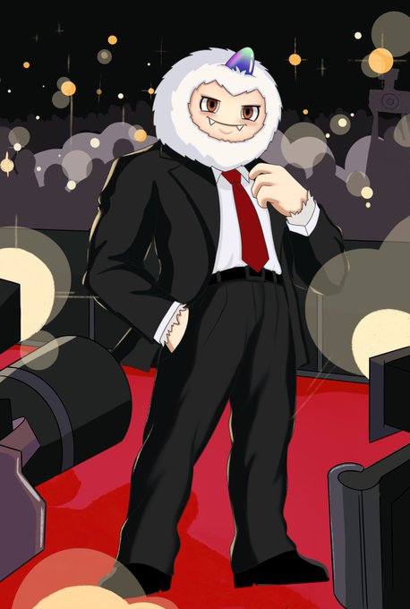 An illustration of a character with a white furry hood featuring a small colorful horn, dressed in a black suit with a red tie, standing confidently on a red carpet at night with city lights in the background.