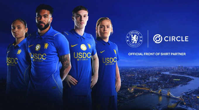 A promotional image showing four Chelsea Football Club players in blue jerseys featuring 'USDC by Circle' sponsor logos, with text 'OFFICIAL FRONT OF SHIRT PARTNER' and a London skyline backdrop.