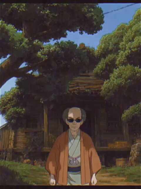 The image features a man wearing an orange kimono, standing outside of a wooden house with trees behind him. The man has sunglasses on his head and appears to be posing for the photo. There are also some text elements present in the image that read "in tibbir we trust @mickymalka".
