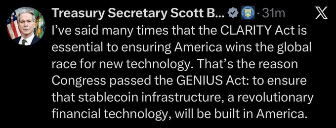 A screenshot of a verified X post by Treasury Secretary Scott Bessent, who emphasizes the importance of the CLARITY Act and notes that Congress passed the GENIUS Act to ensure stablecoin infrastructure is built in America. The accompanying post highlights his statement, reinforcing the same message visible in the image about U.S. leadership in new technology.
