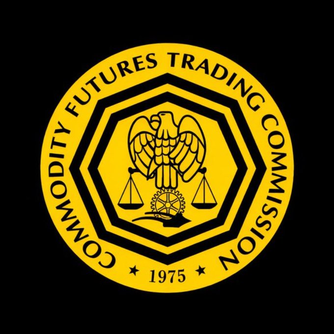 The image features a circular logo for the Futures Trading Commission (FTC), which is an independent regulatory body responsible for overseeing financial markets in the United States. The logo consists of a circle with a black border, inside which there are two black birds facing each other and holding scales. These birds represent the U.S. Treasury Department's commitment to financial stability and integrity. The text "Futures Trading Commission" is written above the birds, indicating that this organization oversees the futures market in the United States.