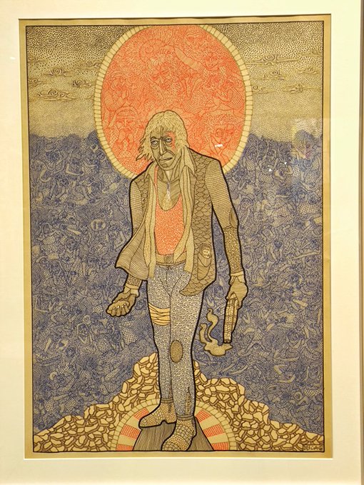 A framed artwork depicting a gaunt, long-haired figure standing before a large red sun-like circle, rendered in a textured, illustrative style.