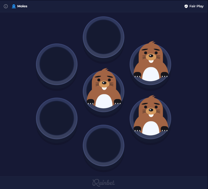 A promotional screenshot for the new Rainbet Original game "Moles," featuring cartoon moles peeking out of circular holes on a dark blue background, with "Moles" labeled in the top left and "Rainbet" branding at the bottom.