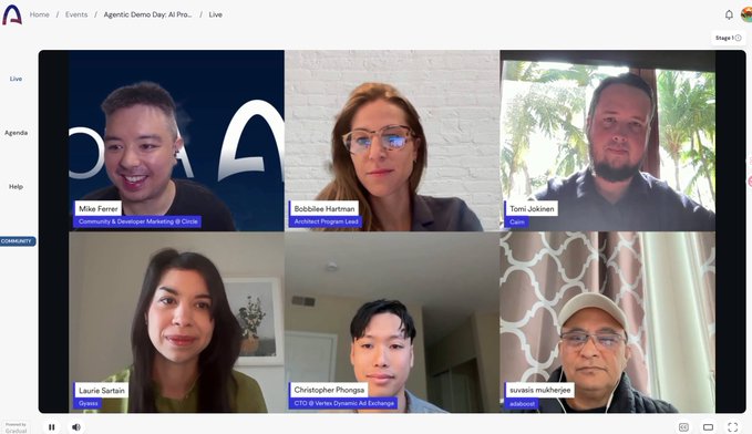 The image shows a group photo of six people sitting around a table for an online meeting or conference call using a video conferencing platform like Zoom. The participants are all facing the camera, with their names displayed at the bottom of the screen. The background reveals that they are in a room with a white wall and a window, which suggests that this could be an office setting. The image also includes text that reads "On-site at Agentic Builders on @arc Attended the arc community's Agentic Demo Day" and "Focus on what is in the image and how it relates to the post".