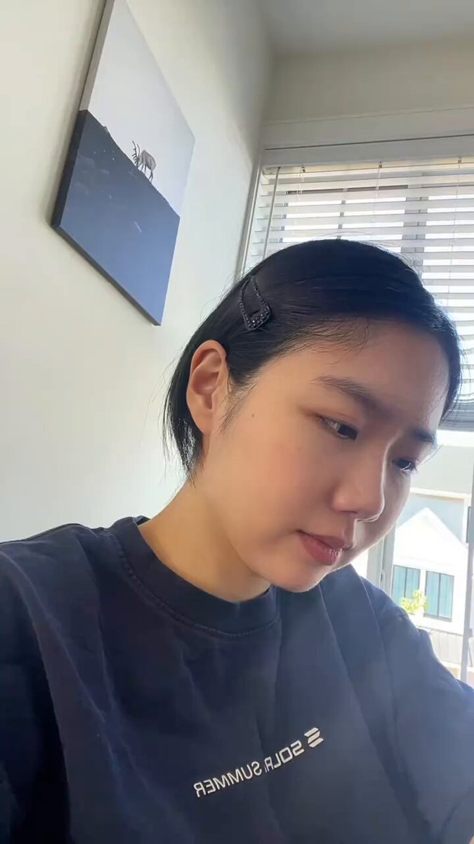 The image features a young woman wearing a black sweatshirt with white text that reads "Solana". The photo also includes a caption about the post, which seems to be related to the popular social media platform, Instagram.