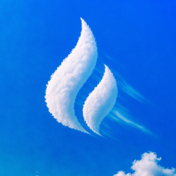 Two fluffy clouds shaped like flames float against a vibrant blue sky, symbolizing the midweek spark of motivation. The flame imagery pairs with the optimistic message about pushing forward toward the weekend and reaching new highs.