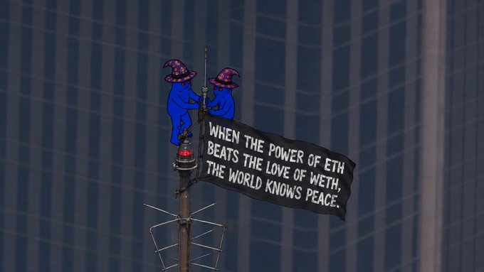 Two blue wizards in purple hats sit on a communications tower holding a banner reading 'WHEN THE POWER OF ETH BEATS THE LOVE OF WETH, THE WORLD KNOWS PEACE.'
