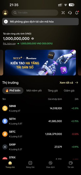 The user wants a caption for the provided image, which is a screenshot of a cryptocurrency trading app interface.

**1. Analyze the Image:**
*   **App Interface:** It looks like a Vietnamese crypto exchange or trading platform (likely SCB or similar, given "SCEX" in the banner).
*   **Top Bar:** Time 21:35, battery 75%.
*   **Notification:** "Mở phòng giao dịch tài sản mà hóa" (Open an asset trading room to earn).
*   **Balance:** "Tài sản ròng ước tính (VND) 1,000,000,000" (Estimated net assets (VND) 1,000,000,000). This is a key number.
*   **Banner Ad:** "SCEX x Remitano KIẾN TẠO HA TẶNG TẠ