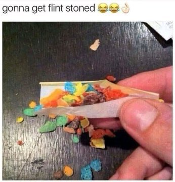 This image shows a hand rolling a joint filled with colorful cereal, with the text "gonna get flint stoned" above it, alluding to the cereal's mascot and a common slang term for being intoxicated, which directly relates to the user's post about "wake n bake" and the ticker $sol.