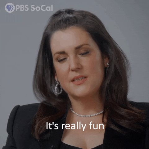 The image features a woman with long brown hair wearing a black blazer and pearl earrings, who appears to be talking or laughing. The caption of the image reads "It's really fun" which seems to be related to the content of the post about Elon Musk's bag holders.