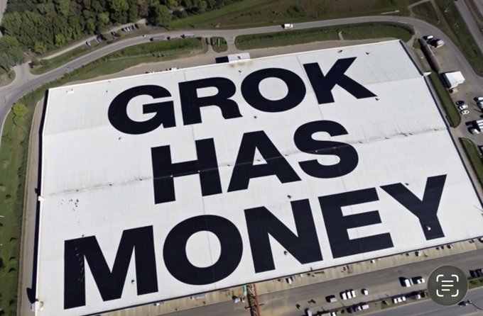 The image shows an aerial view of a large warehouse roof with massive painted text reading "GROK HAS MONEY," which appears to be a witty commentary suggesting that Grok (likely referring to an AI or Elon Musk's chatbot) has financial resources to bail out struggling crypto projects like DebtRelief Bot (DRB). The sarcastic tone of the mural contrasts with the earnest Coinbase listing announcement for DRB, implying the token may need financial rescue.