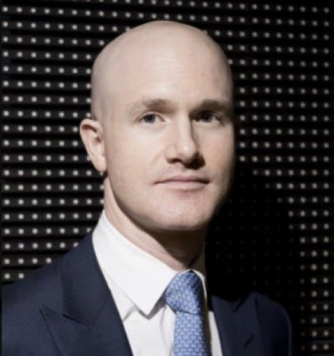 A professional headshot of Coinbase CEO Brian Armstrong, a bald man in a dark suit and light blue tie, posed against a dark dotted backdrop. The image accompanies a bullish post about his recent statements on the CLARITY Act passing, signaling potential progress in crypto regulation.