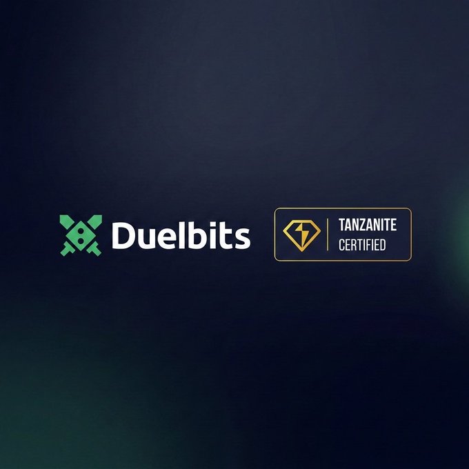 A dark promotional graphic for 'Duelbits' featuring their crossed swords logo alongside a 'TANZANITE CERTIFIED' badge.