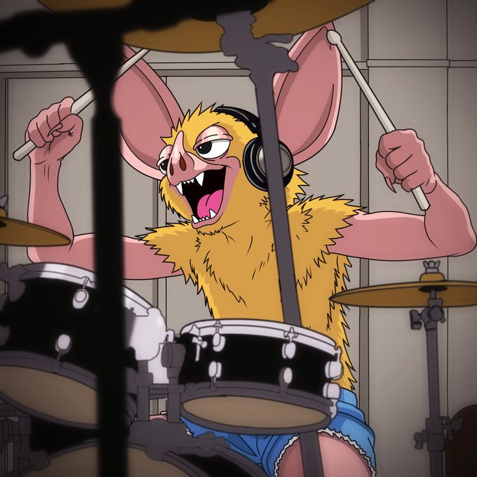 An animated furry bat-like creature with large ears and headphones energetically plays a drum set with drumsticks raised.
