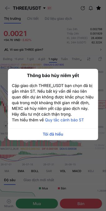 Screenshot of a Vietnamese cryptocurrency trading app showing a 'Thông báo hủy niêm yết' (Delisting Notice) popup for the THREE/USDT trading pair.