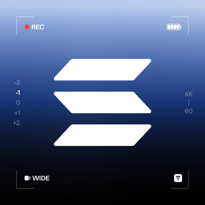 A camera viewfinder recording screen displays a blue gradient background with white geometric parallelogram shapes stacked vertically, framed by REC indicator, battery icon, exposure scale (-2 to +2), "4K 60" settings, and "WIDE" label, suggesting a different visual perspective on an everyday scene.