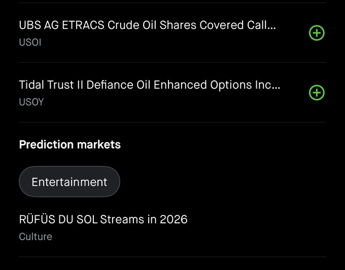 A mobile app screenshot showing financial instruments including 'UBS AG ETRACS Crude Oil Shares Covered Call...' (USOI) and 'Tidal Trust II Defiance Oil Enhanced Options Inc...' (USOY), followed by a 'Prediction markets' section with an 'Entertainment' button and 'RÜFÜS DU SOL Streams in 2026' under Culture.
