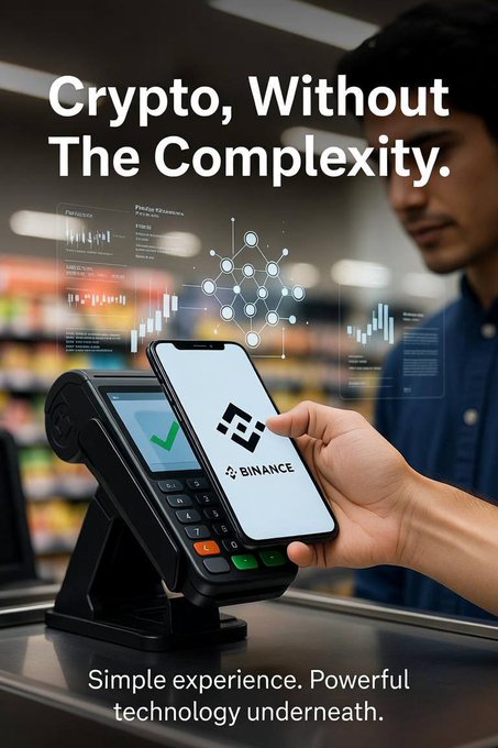A Binance promotional graphic featuring a person holding a smartphone displaying the Binance logo over a card payment terminal, with the text 'Crypto, Without The Complexity' and 'Simple experience. Powerful technology underneath.'
