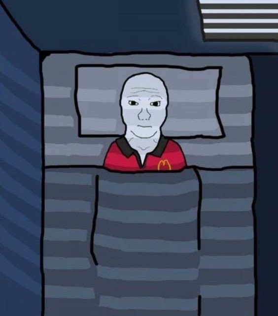 A 'Wojak' style meme depicting a bald man in a red McDonald's polo shirt lying in bed with gray striped sheets, staring at the viewer with a blank expression.