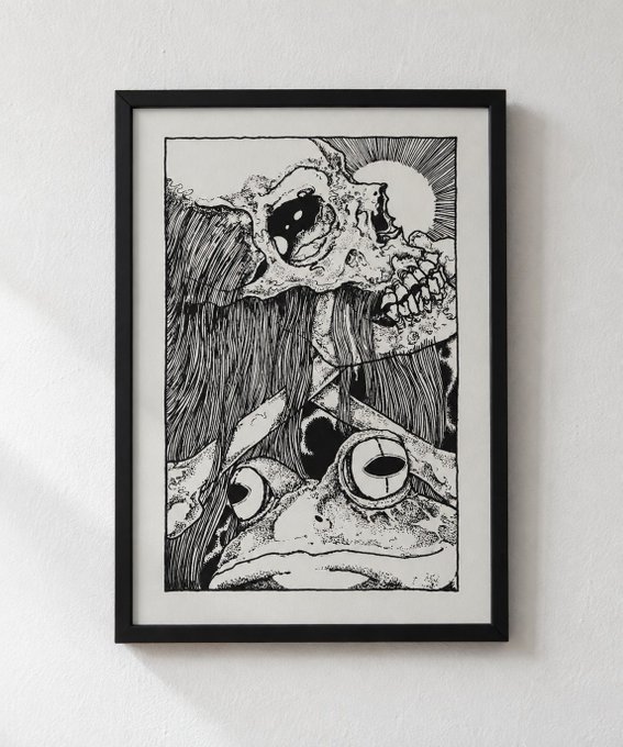 A framed black and white ink drawing displayed on a white wall, depicting a surreal illustration of a skull, an eye, and flowing hair with the word "Tsumari" visible.