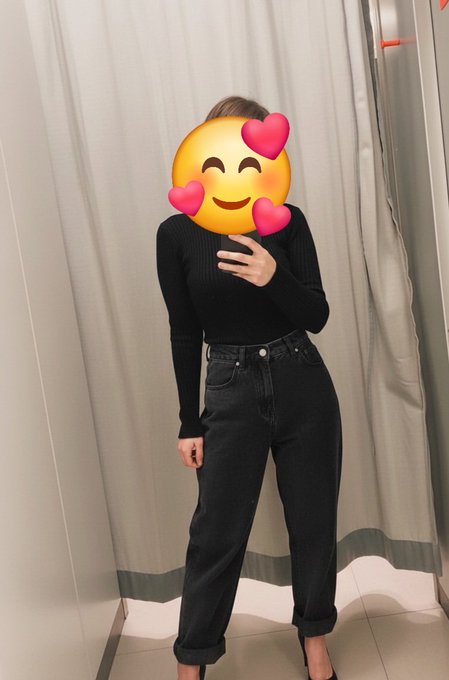 A person taking a mirror selfie in a fitting room, wearing a black fitted long-sleeve top and cuffed black jeans, with their face covered by a heart-eyes emoji to protect their identity. The image aligns with the post's description of a 30-year-old from Morocco seeking to connect with others in the Web3 community.