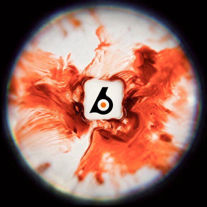 A circular view shows a white icon with a black "6" and orange center swirling amid vivid orange and white smoke, resembling a solar flare or explosion in space, symbolizing the "sunrise" of Eli Lilly's stock token ($LLY) on the Solana blockchain.