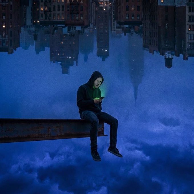 A surreal digital artwork of a young person in a black hoodie sitting on a steel beam in the sky, looking at a glowing green phone, while an inverted city skyline hangs above them.